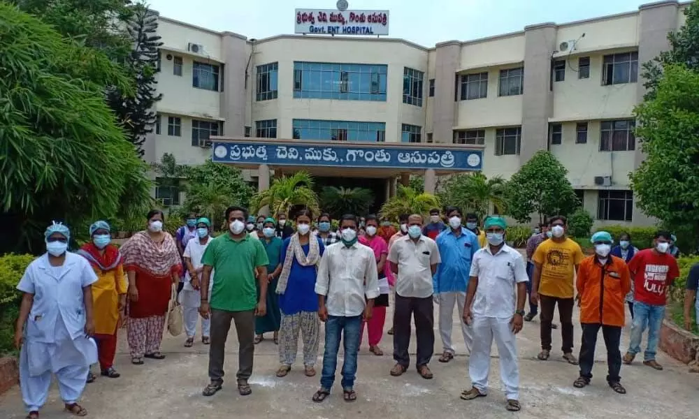 Outsourcing staff of the Government ENT Hospital staging a protest in Visakhapatnam on Monday