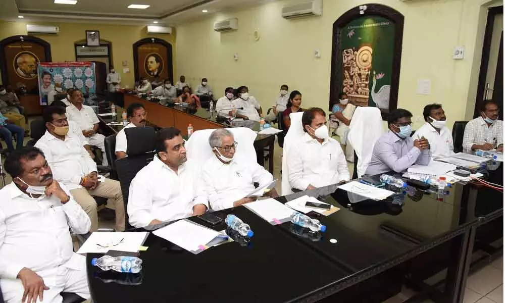 Minister for Fisheries Mopidevi Venkata Ramana Rao, YSRCP floor leader in the State Legislative Council Ummareddy Venkateswarulu, MLAs Kasu Mahesh Reddy, Vidadala Rajini, Md Mustafa, Maddali Giridhara Rao, MLC Jaga Krishna Murthy and District Collector I Samuel Anand Kumar attending CMs video conference from the Collectorate in Guntur on Monday