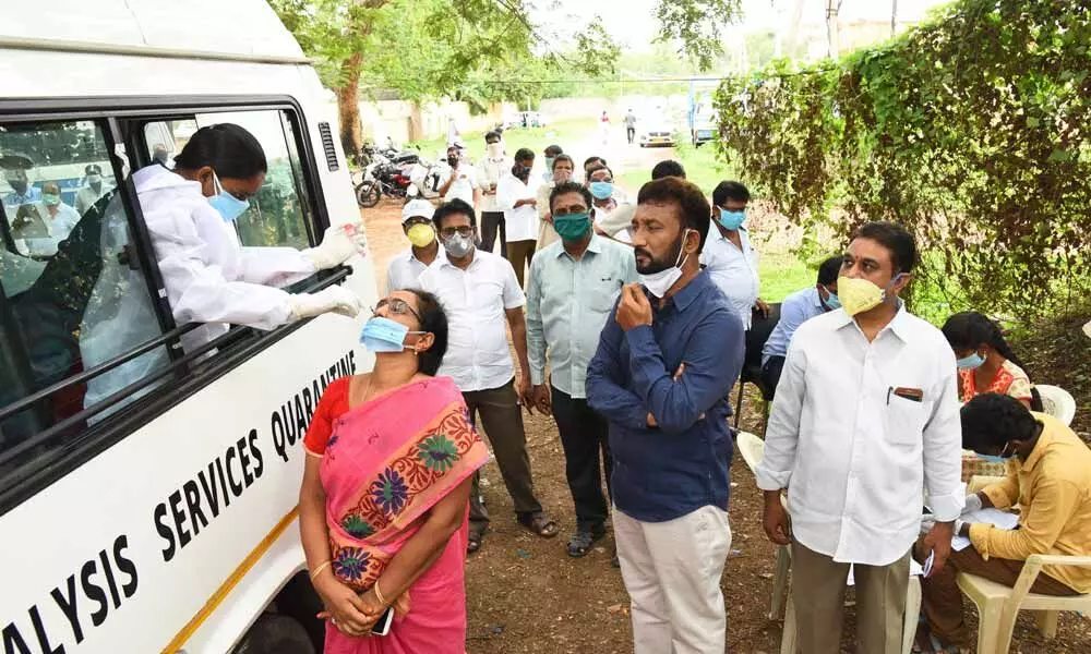 Covid-19 tests in progress at the irrigation office in Vijayawada on Monday