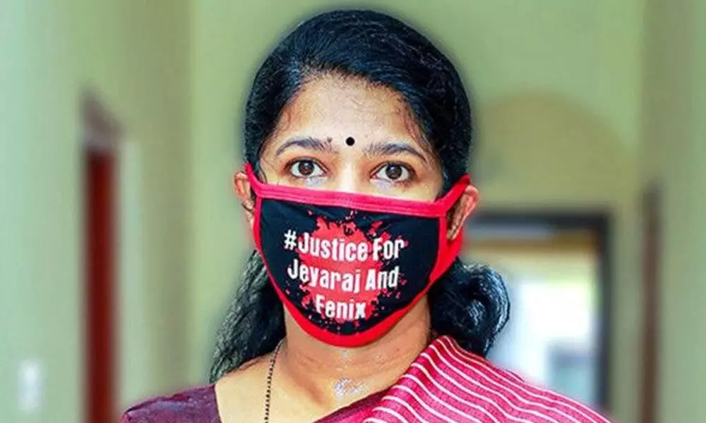 DMK MP Kanimozhi wears a mask with a message, in solidarity with Tuticorin custodial victims, in Tuticorin district