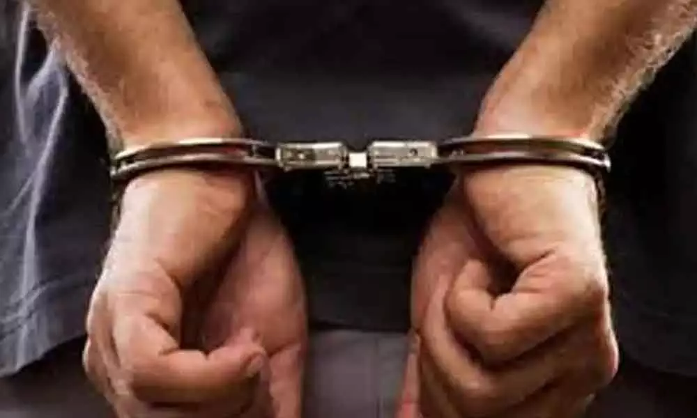 Two officials arrested for taking bribe