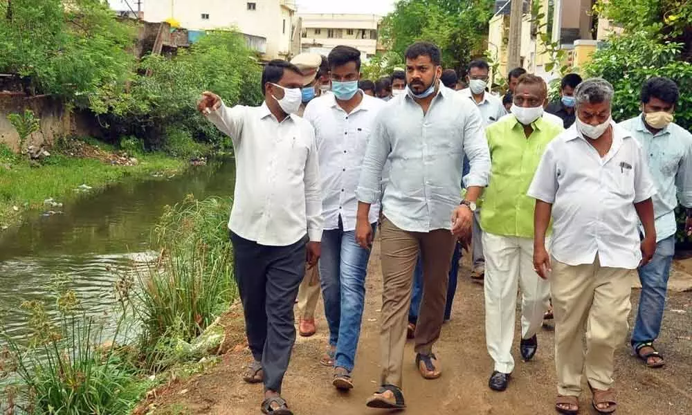 Minister for Water Resources Dr P Anil Kumar Yadav inspecting the status of canals in Nellore on Wednesday