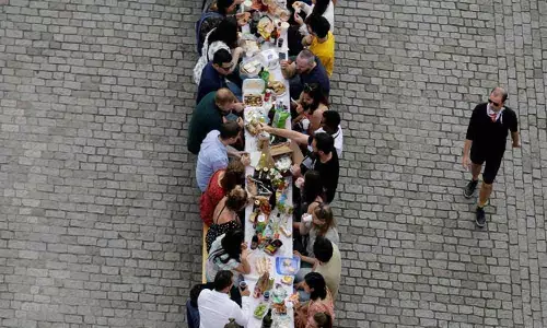 At 500-metre table, Prague Citizens See Coronavirus Out with a Dinner on the Medieval Charles Bridge