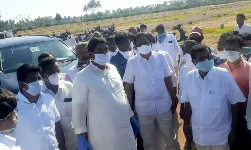 YSRCP Srikakulam MLA D Prasada Rao inspecting house sites at Linglavalasa under Srikakulam rural mandal on Thursday