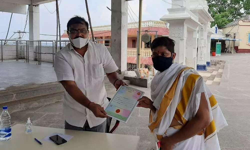 Annavaram Devasthanam Executive Officer Vendra Trinatha Rao presenting certificates to the Vedic students in Annavaram