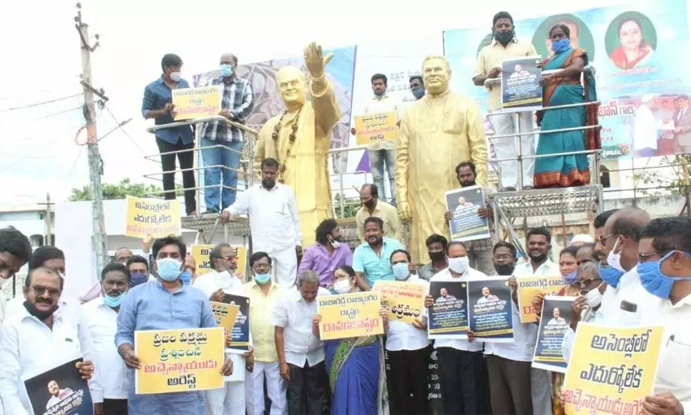 TDP leaders staging a silent protest in Srikakulam on Thursday