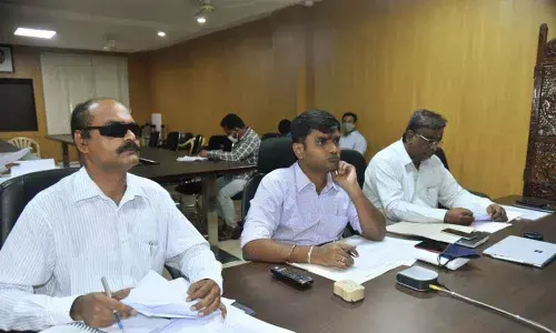 District Collector N B Gupta (centre) addressing officials through video conference in Chittoor on Friday