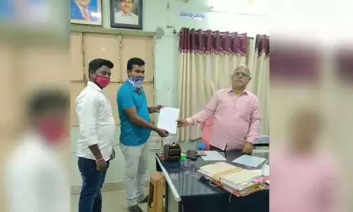 PDSU leader J Rajeshwar submitting a memorandum to the DEO at his office in Nizamabad on Friday