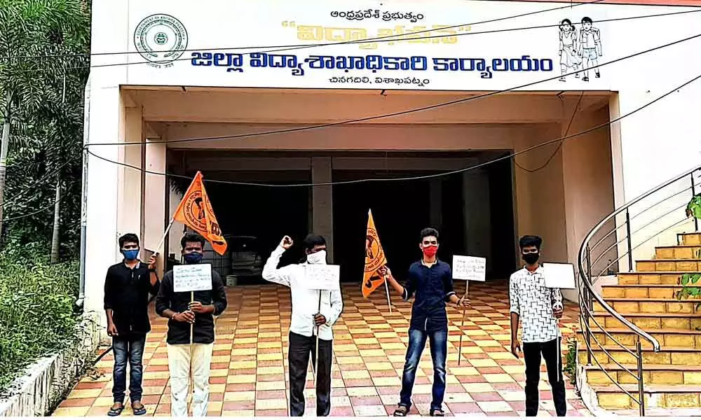 ABVP members staging protest against collection of fees at DEO office in Visakhapatnam on Friday