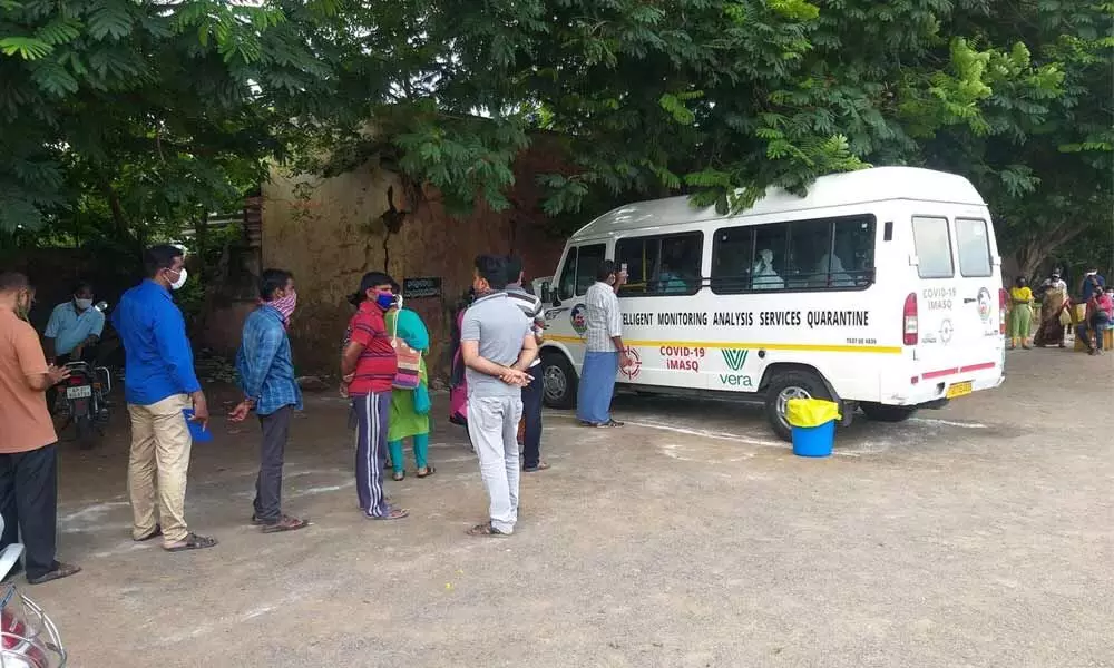 People waiting for the Covid-19 test at MB Municipal Corporation Stadium in Ajit Singh Nagar in Vijayawada.