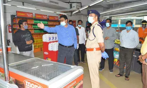 Collector MV Seshagiri Babu visiting a shopping mall in Nellore on Monday along with SP Bhaskar Bhushan