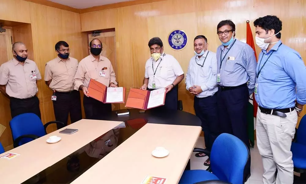 Dr Dasharath Ram, Director, DRDL and P Radha Krishna, Director (Production), BDL, with agreement documents on Akash missile weapon system