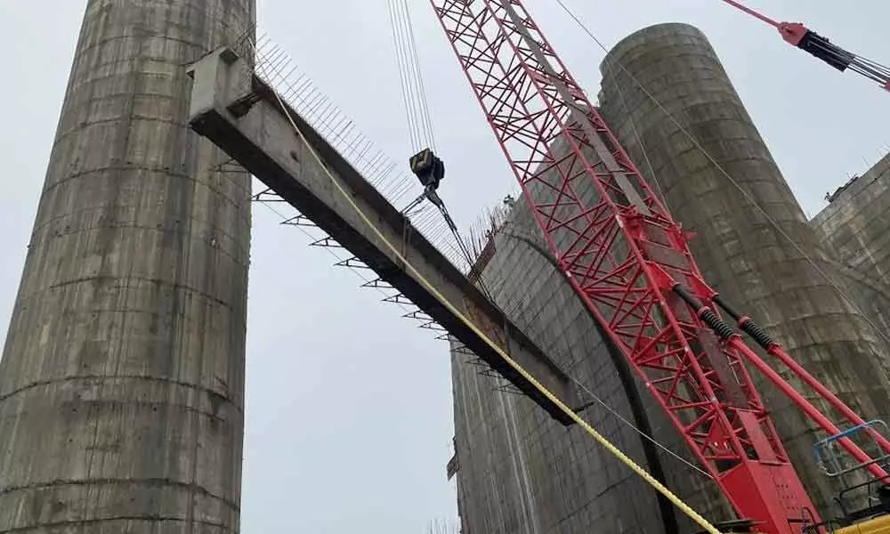 Placing of world’s biggest girders on spillway begins