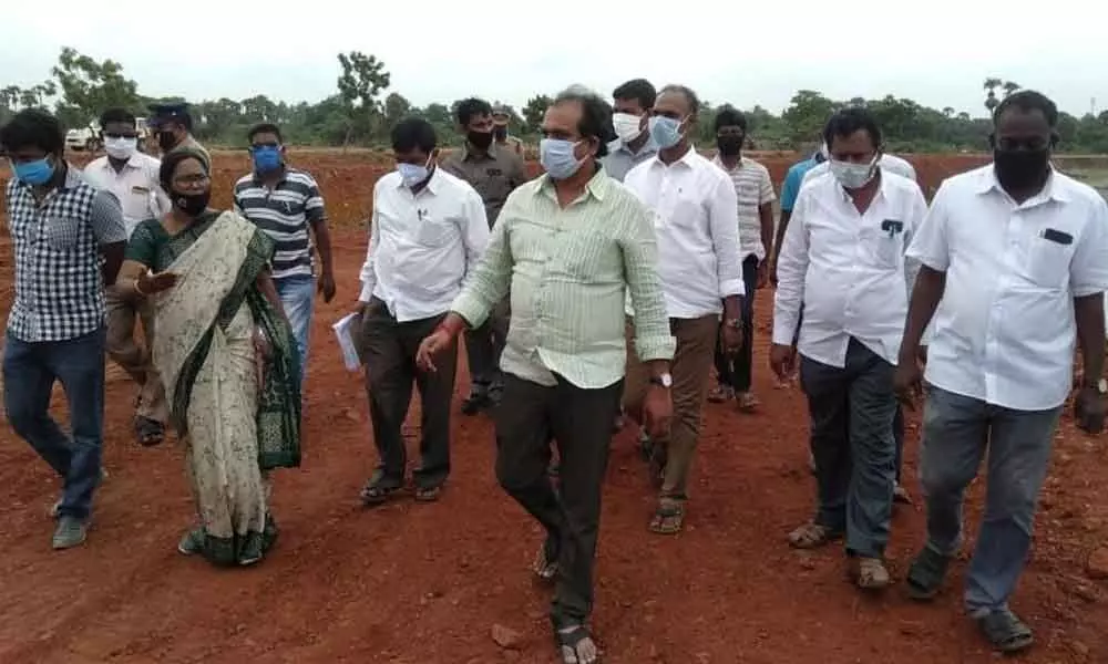 Agriculture Minister Kurasala Kannababu inspecting house site layout works at Nemam village in Kakinada Rural mandal on Monday