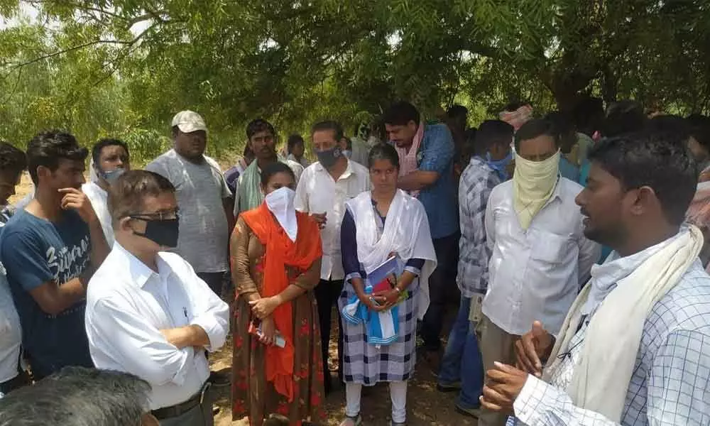 Farmers arguing with the officials, opposing canal works of Sri Sitarama Lift Irrigation project works in Tirumulaypalem village