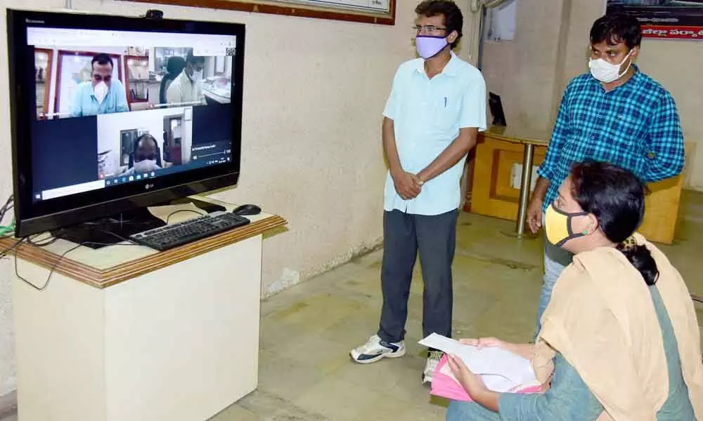 District Collector RV Karnan interacting with a petitioner through online grievance meeting in Khammam on Monday