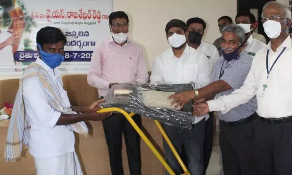 MLA Kunduru Nagarjuna Reddy and chairman of NS Agricuture and Horticulture College Nadella Chandramouli distributing tools to farmers in Markapuram
