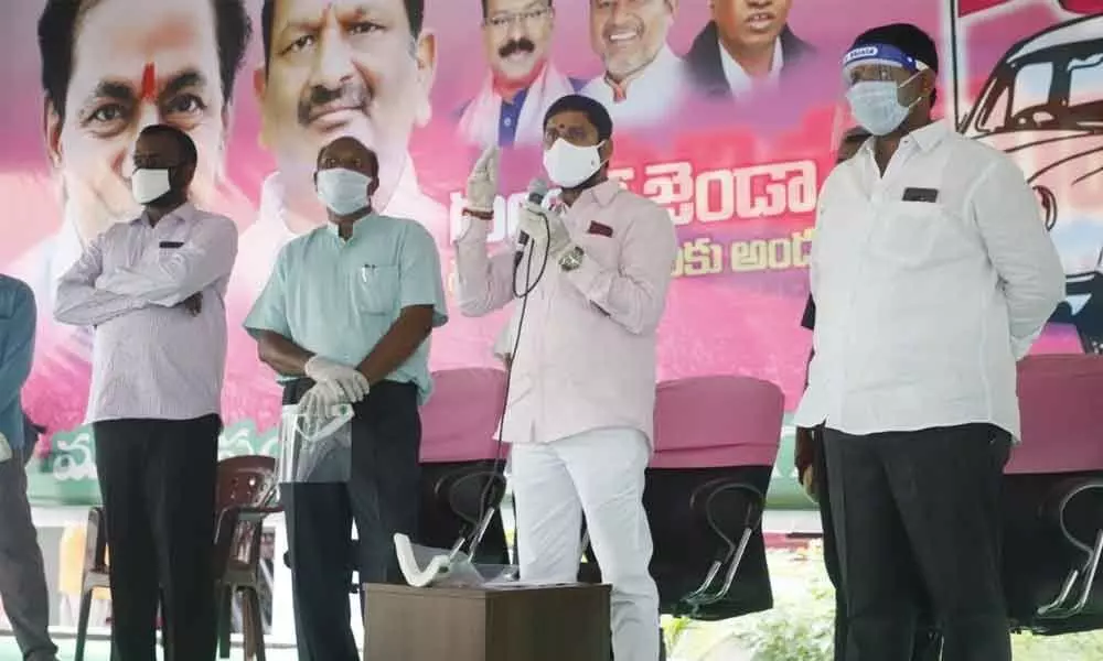 MLA K Chander Patel speaking after distributing CMRF cheques to the beneficiaries at a programme in Ramagundam on Thursday