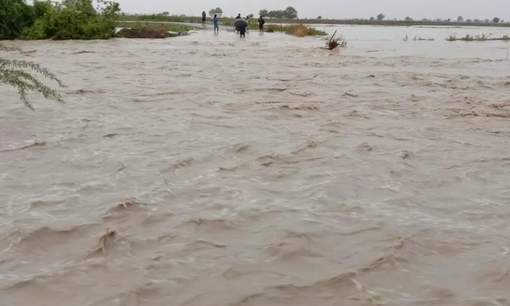 The Vallampadu lake in Kovelakuntla  overflowing with floodwater in Kurnool district