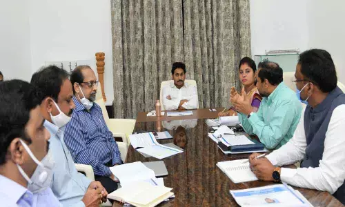 Chief Minister Y S Jagan Mohan Reddy reviewing Recognition of Forest Rights (RoFR) at his camp office in Tadepalli on Friday