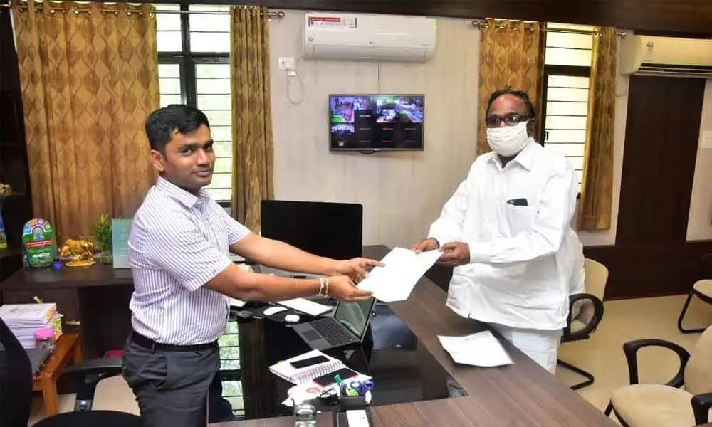 MLC Y Srinivasulu Reddy submitting a representation to District Collector N B Gupta in Chittoor on Friday