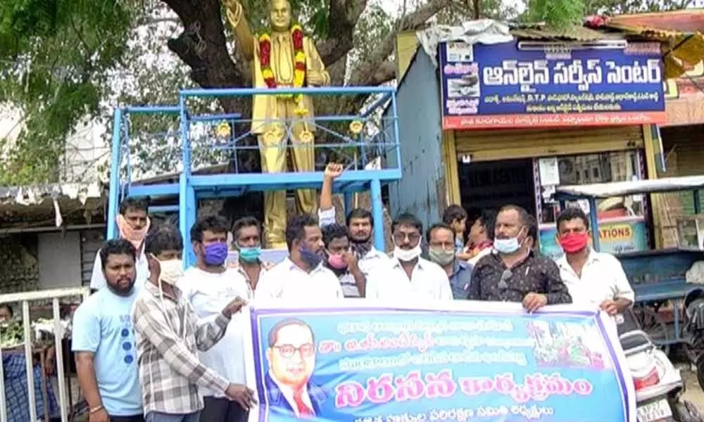 DHPS leader Neelam Nagendra Rao and others protesting against the attack on Rajgruha in Ongole on Friday