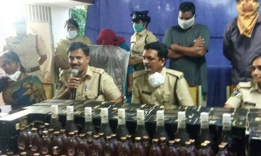 West Godavari SP KN Narayan announcing the arrest of Excise CI and police SI in illegal liquor transport case