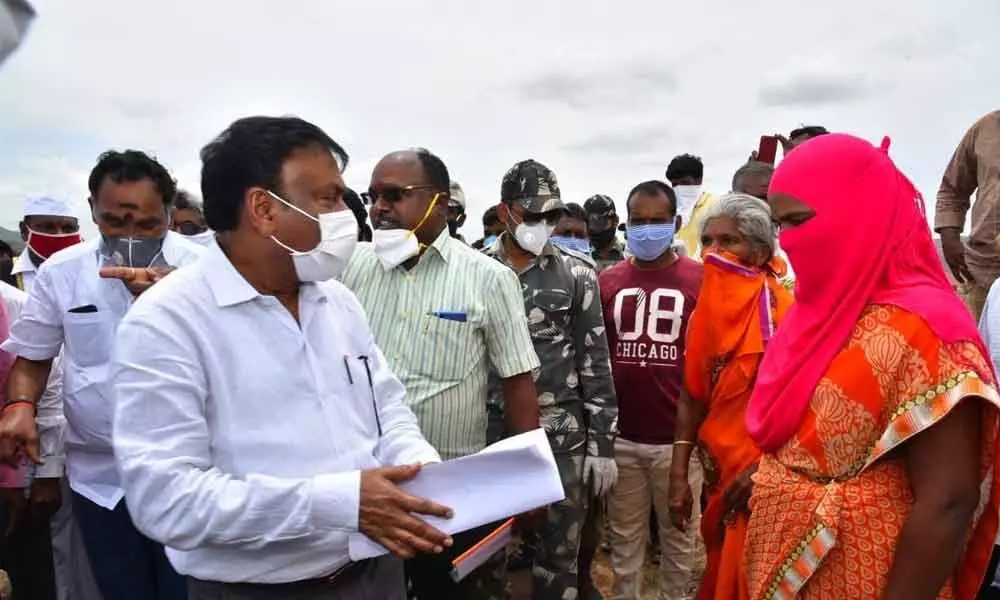 Prakasam District Collector Pola Bhaskara, MLA Anna Rambabu and other officers interacting with the Veligonda oustees at Kakatla dam on Friday