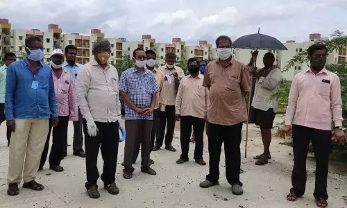 APUCF members led by its president Ch Babu Rao visit houses at Mangalagiri on Saturday