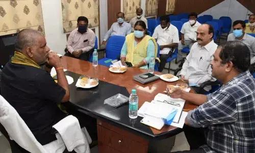 TUDA chairman Chevireddy Bhaskar Reddy addressing a review with vice-chairman S Harikrishna, secretary S Lakshmi and other officials in Tirupati on Saturday