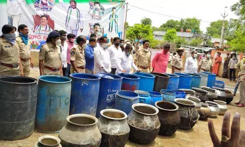 Families engaged in arrack preparation voluntarily returning equipment used in arrack making