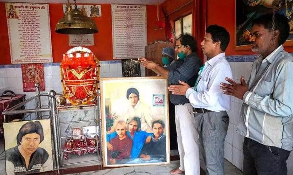 Fans of Bollywood mega star Amitabh Bachchan pray for his speedy recovery from COVID-19, at a temple in Bhopal