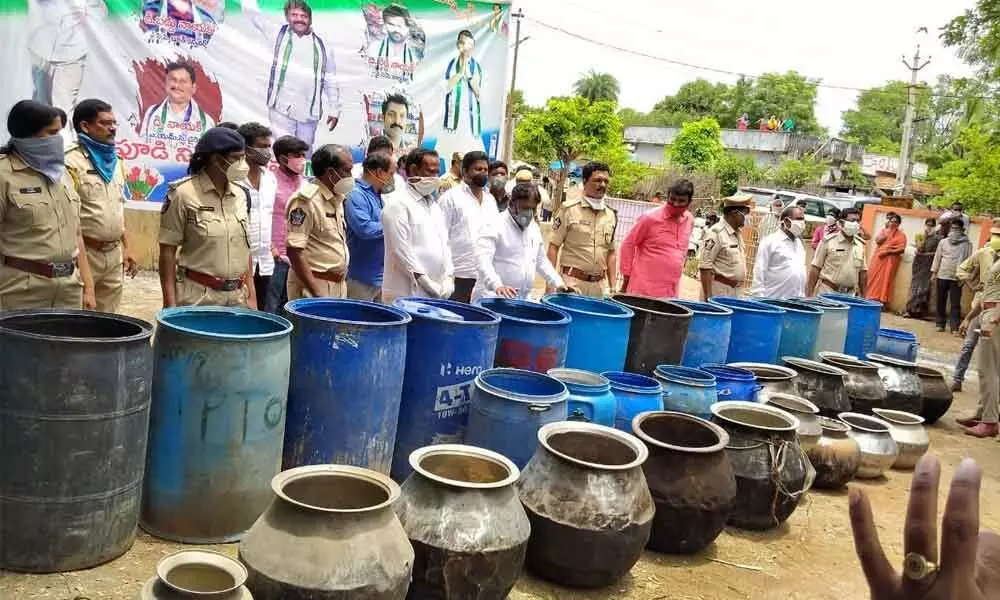 Families engaged in arrack preparation voluntarily returning equipment used in arrack making