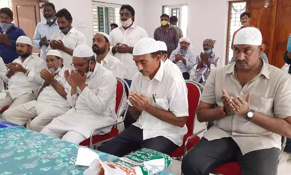 YSRCP leader Dukkipati Sasidhar (second from right) and minority leaders participating in prayers after inauguration of Anjuman building in Gudivada on Sunday