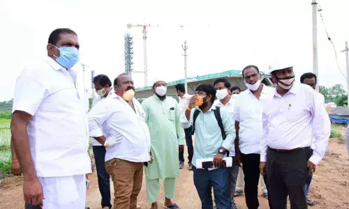 Minister Gangula Kamalakar inspecting the construction works of cable bridge in Karimnagar on Monday