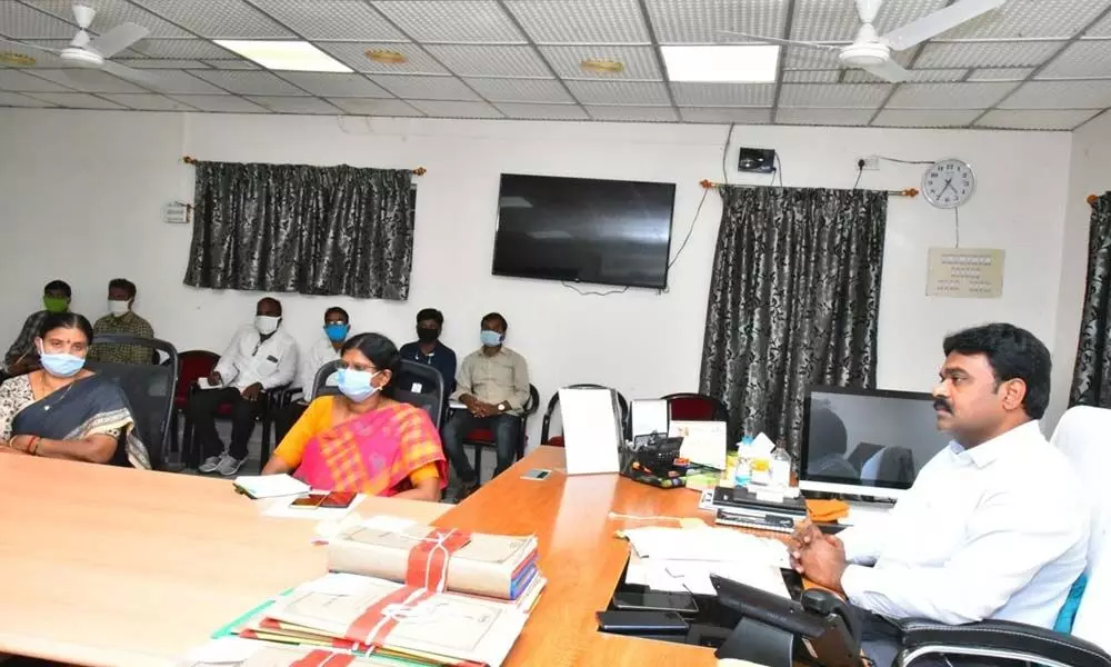 Prakasam District Joint Collector J Venkata Murali holding a meeting with registration officials in Ongole on Monday