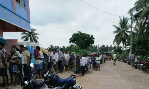 Large number of boozers gathered in front of a liquor shop at Kanimetta village in Ponduru mandal on Tuesday