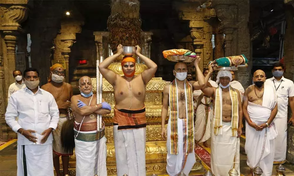 Priests and TTD officials participating in Koil Alwar Tirumanjanam at Tirumala temple on Tuesday