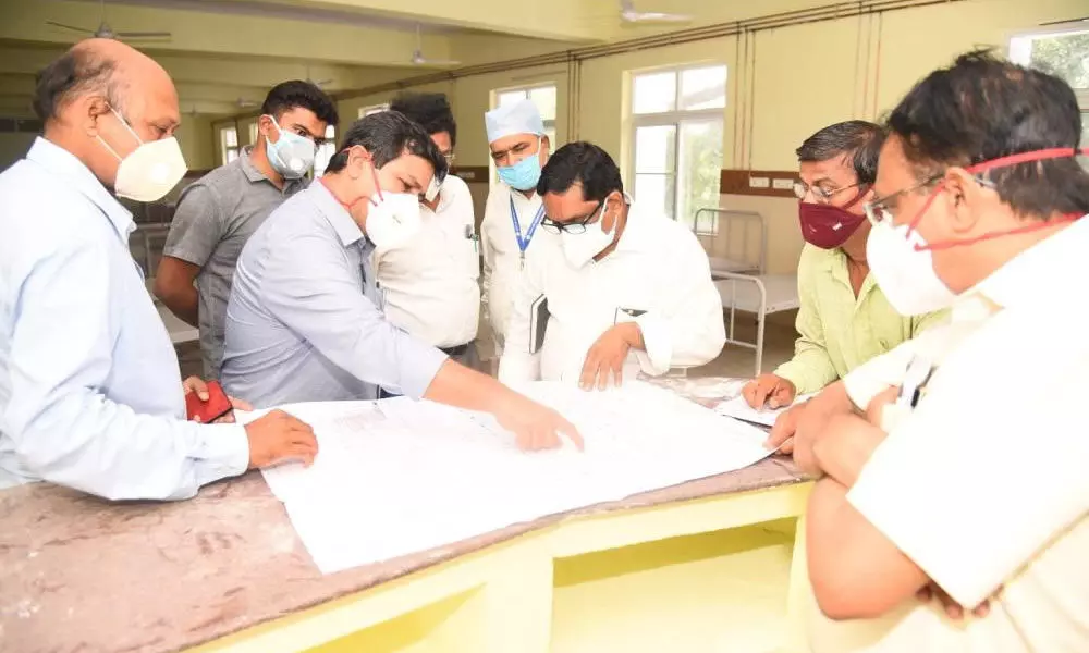 District Collector V Vinay Chand instructing health officials to step up arrangements at VIMS in Visakhapatnam