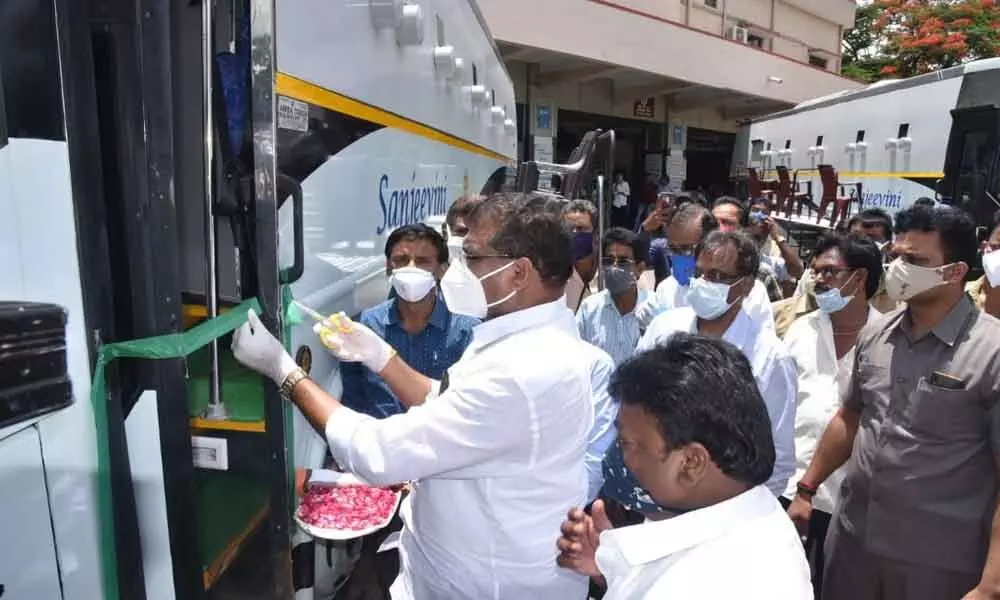 Municipal Administration Minister Botcha Satyanarayana inaugurating Sanjeevini buses meant for conducting corona tests in Vizianagaram on Thursday