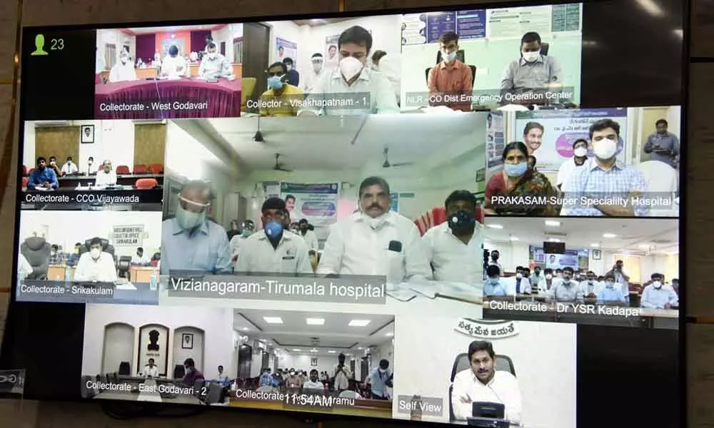 Chief Minsiter Y S Jagan Mohan Reddy holding video conference with District Collectors and SPs from his camp office at Tadepalli on Thursday