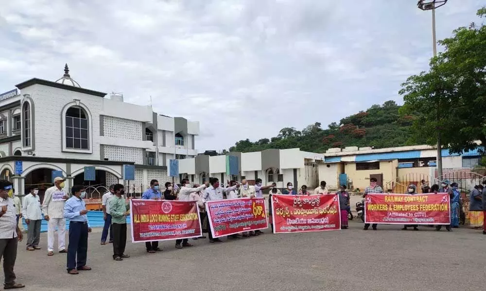 CITU leaders staging a dharna at railway station in Vijayawada on Friday