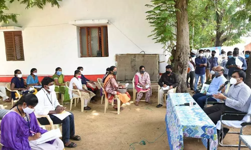 District Collector KVN Chakradhara Babu interacting with employees of Inamadugu Grama Sachivalayam