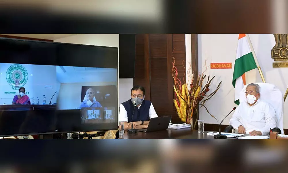 Governor Biswa Bhusan Harichandan holding a review meeting with officials on Covid-19 through video conference