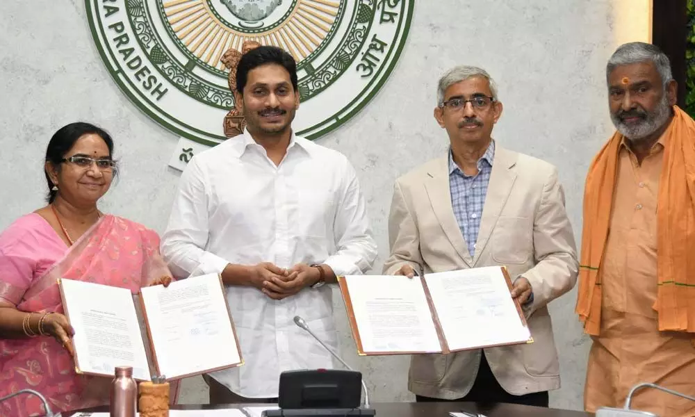 Agriculture CS Poonam Malakondaiah, Amul Chennai Zonal head Rajan exchange copies of MoU in the presence of Chief Minister YS Jagan Mohan Reddy