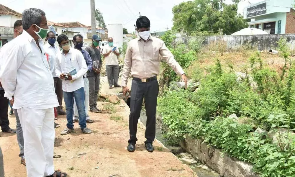 District Collector C Narayana Reddy checking drainage management in Keshpalli village on Tuesday