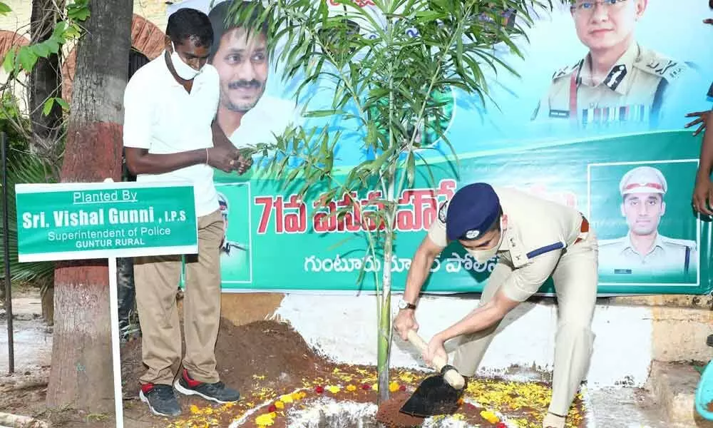 Guntur rural SP Vishal Gunny planting saplings at DPO in Guntur on Thursday