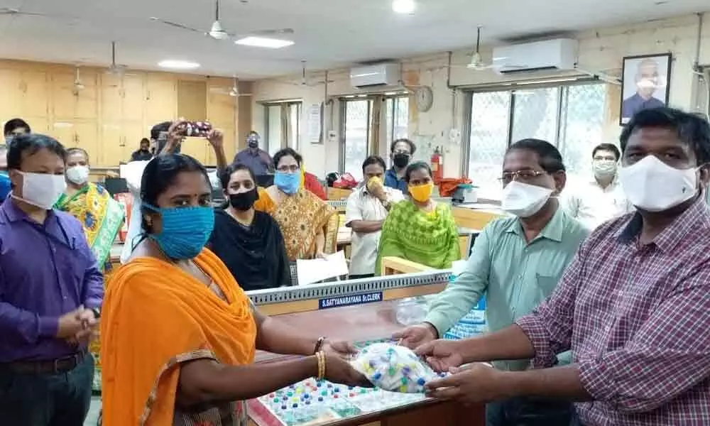 Waltair Division Health staff distributes homeo medicine to the railway staff in Visakhapatnam on Thursday