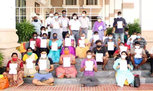Covid positive patients getting discharged from Sri Padmavati Nilayam Covid care centre in Tirupati on Friday. Centres special officer S Lakshmi and others are also seen
