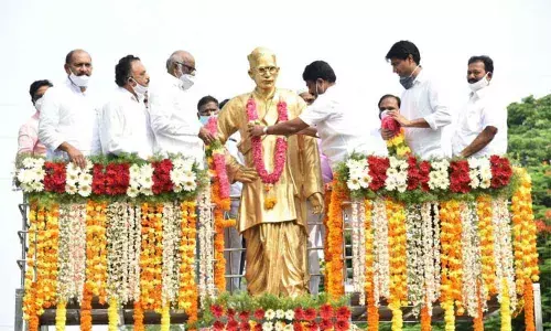Minister for Education Audimulapu Suresh garlanding  the statue of poet and writer Gurram Jashuva in  Guntur city on Friday on the occasion  of his 49th  death anniversary.  MPs N Suresh, Lavu Sri Krishnadevarayalu, MLC Dokka Manikya Vara Prasad and MLA Mustafa are also seen